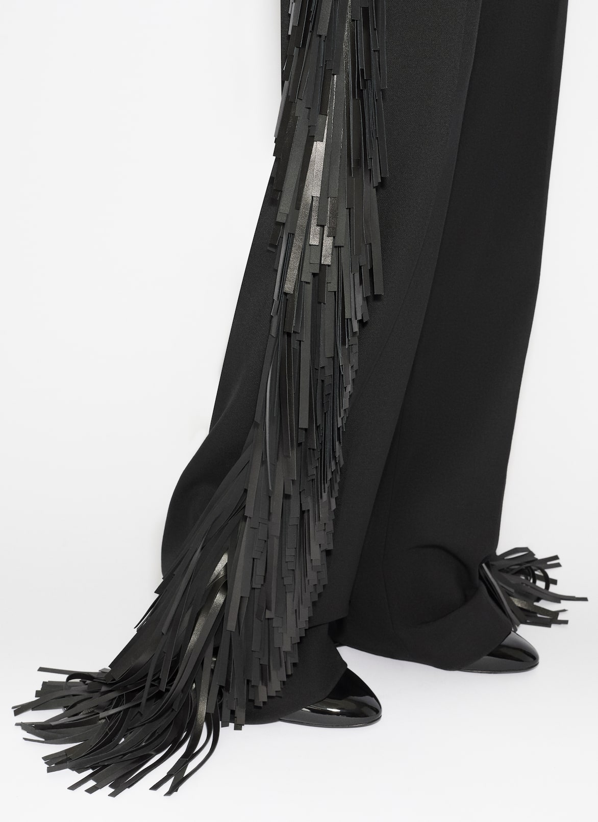 FRANSENHOSE AUS WOLLGABARDINE ALAÏA SCHWARZ FRANSENHOSE AUS WOLLGABARDINE